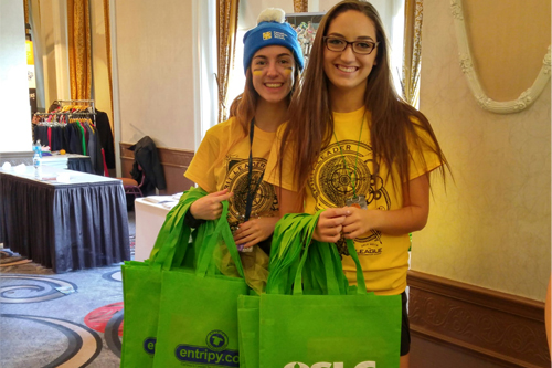Clients wearing their order of custom t-shirts, embroidered hats and custom lanyards.