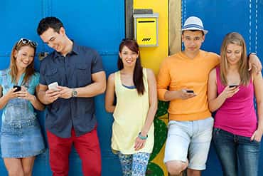 Group of friends wearing colourful trendy custom t-shirts.