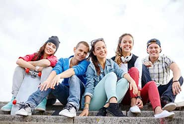 Group of people wearing trendy style custom t-shirts, sweatshirts and custom toques.